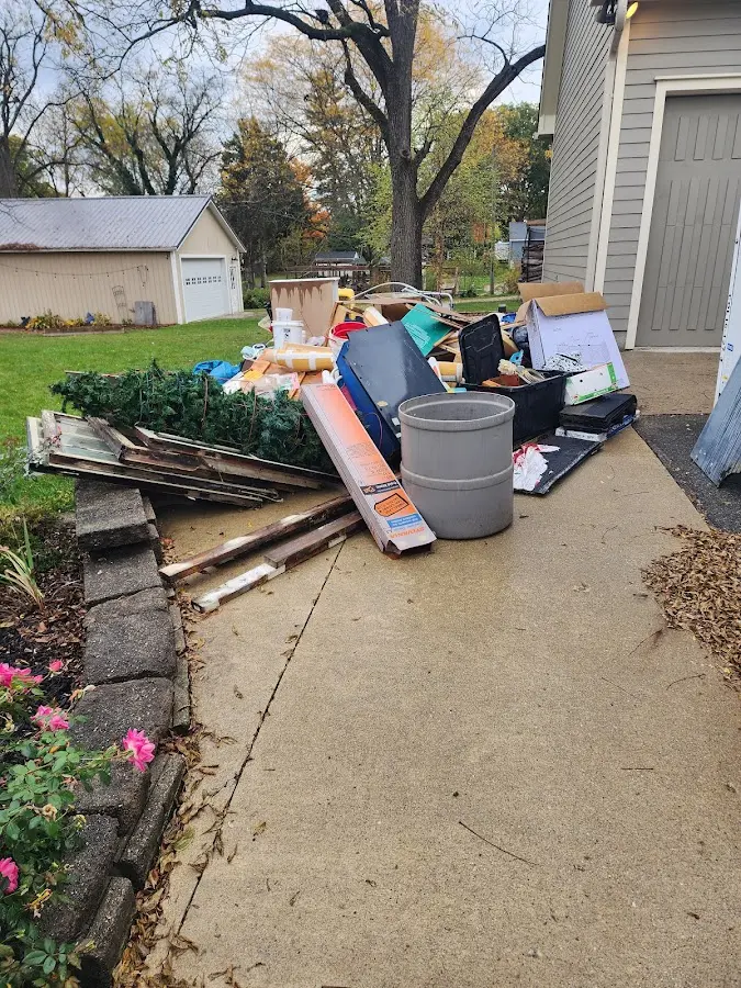 Dumpster being loaded with debris for Commercial Dumpster Rental in Liberal